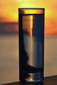 Glass of Water by The Sea Sunset photo