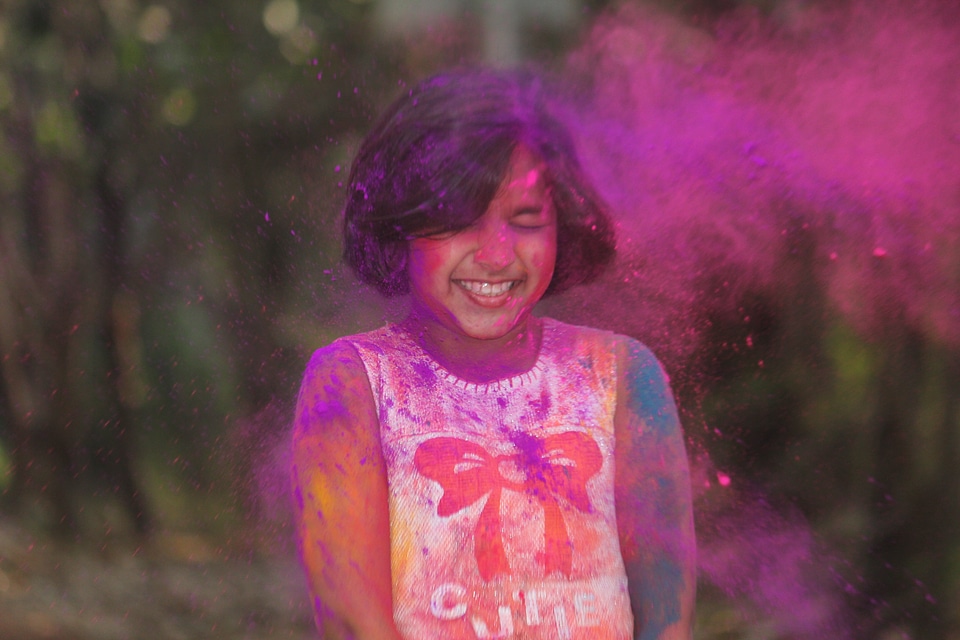 Young Girl Covered in Pink Powder