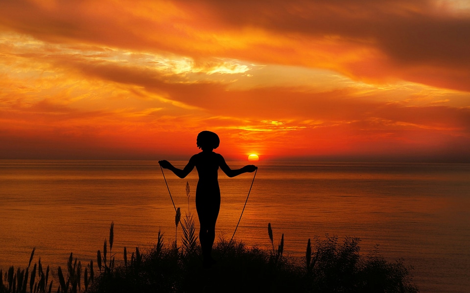Woman playing with jumping rope
