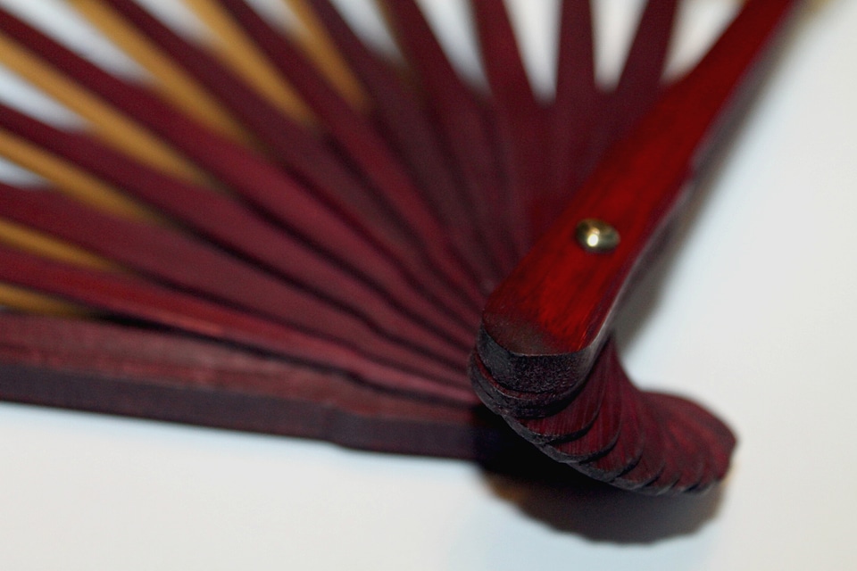 A wooden fan handle