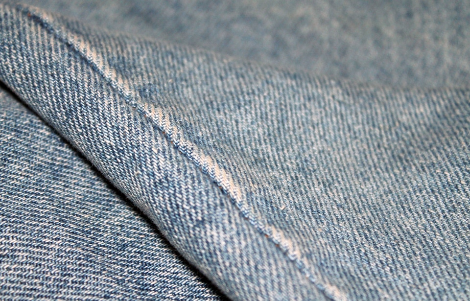 Denim textile with a seam photo