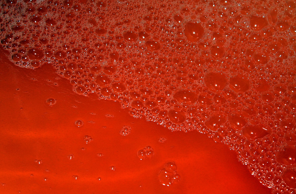 Red water with bubbles