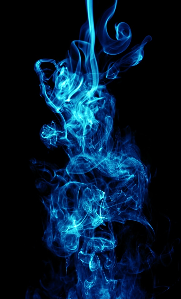 Abstract blue smoke on black photo