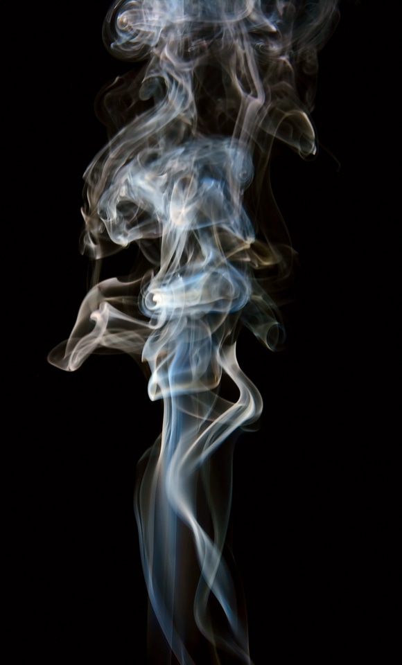 Long swirly smoke on black