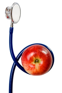 Red apple and stethoscope photo