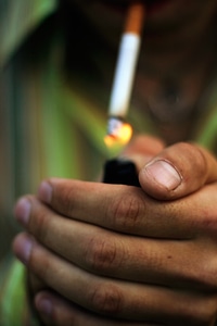 Hands with cigarette photo