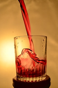 Red Liquid Falling Glass