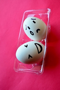 Happy Sad Smiley On Egg photo