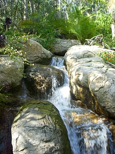 Waterfall cascades rock