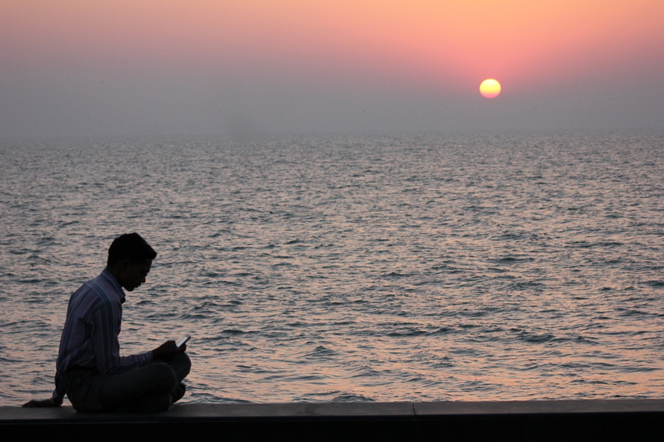 Man Using Mobile Sunset