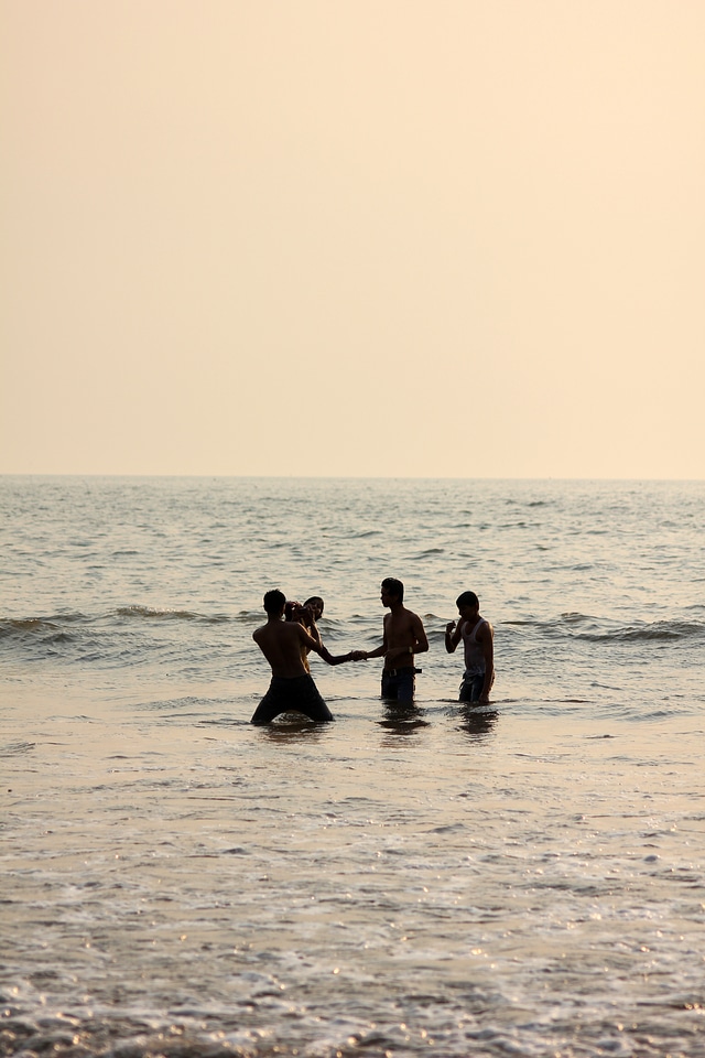 Friends Playing In Sea Beach