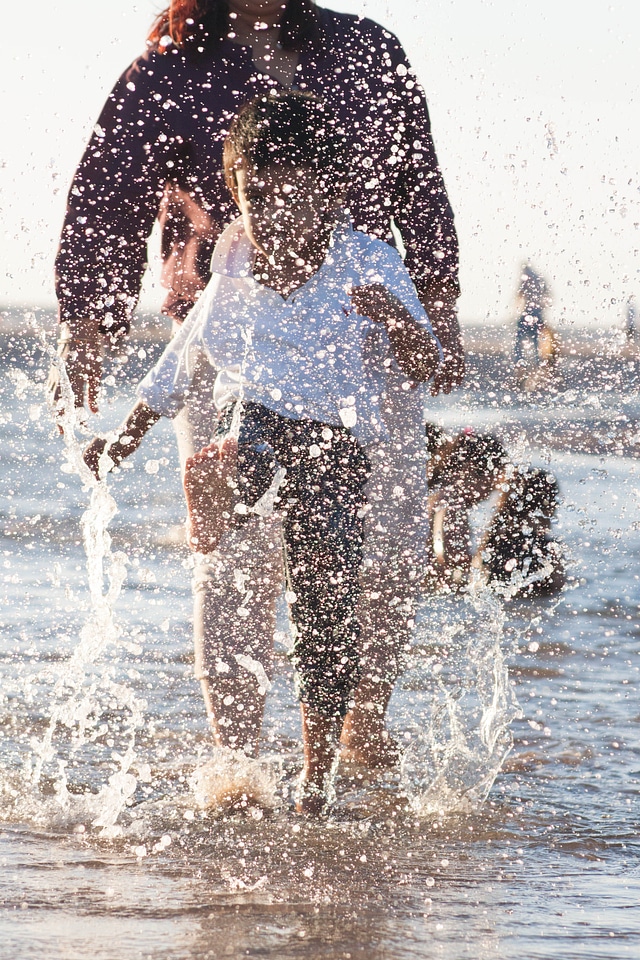 Child Playing In Water