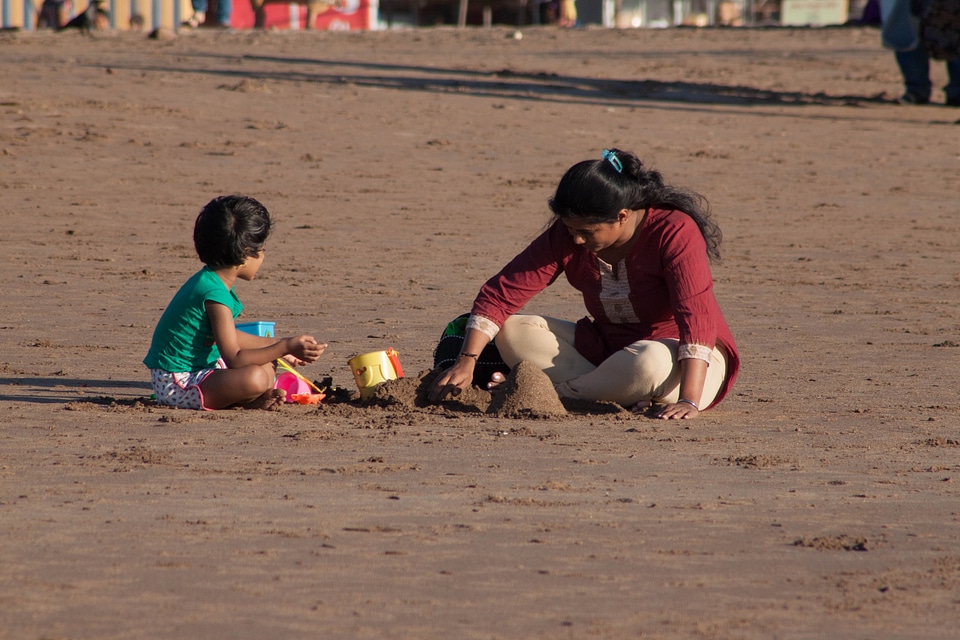 Mother Child Making Sand Castle