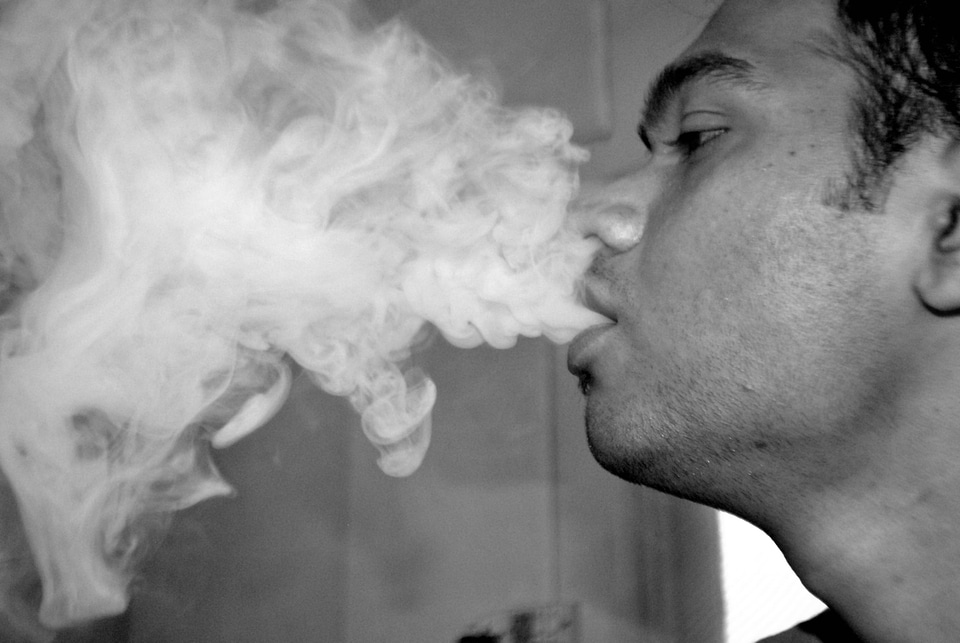 Guy Blowing Smoke Hookah
