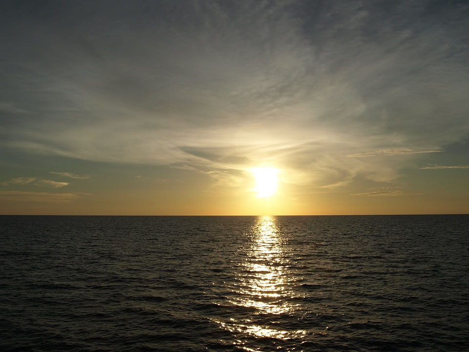 Sun setting sun water