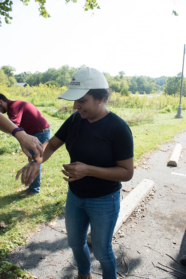 Volunteer with monarch butterfly