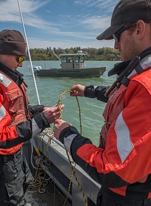 USFWS Fisheries crew baiting lines for lake sturgeon