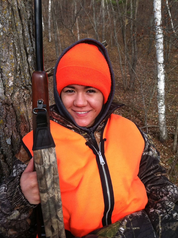 Youth deer hunter in treestand photo