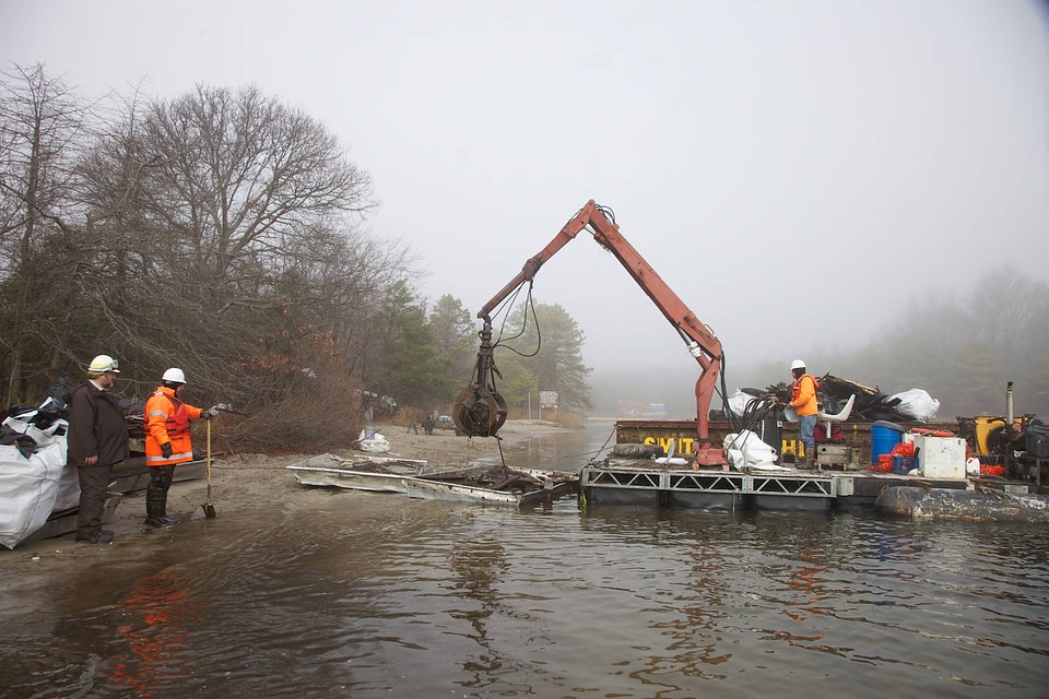 Crane removes storm debris