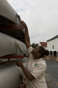 Bureau of Land Management student securing a canoe rack