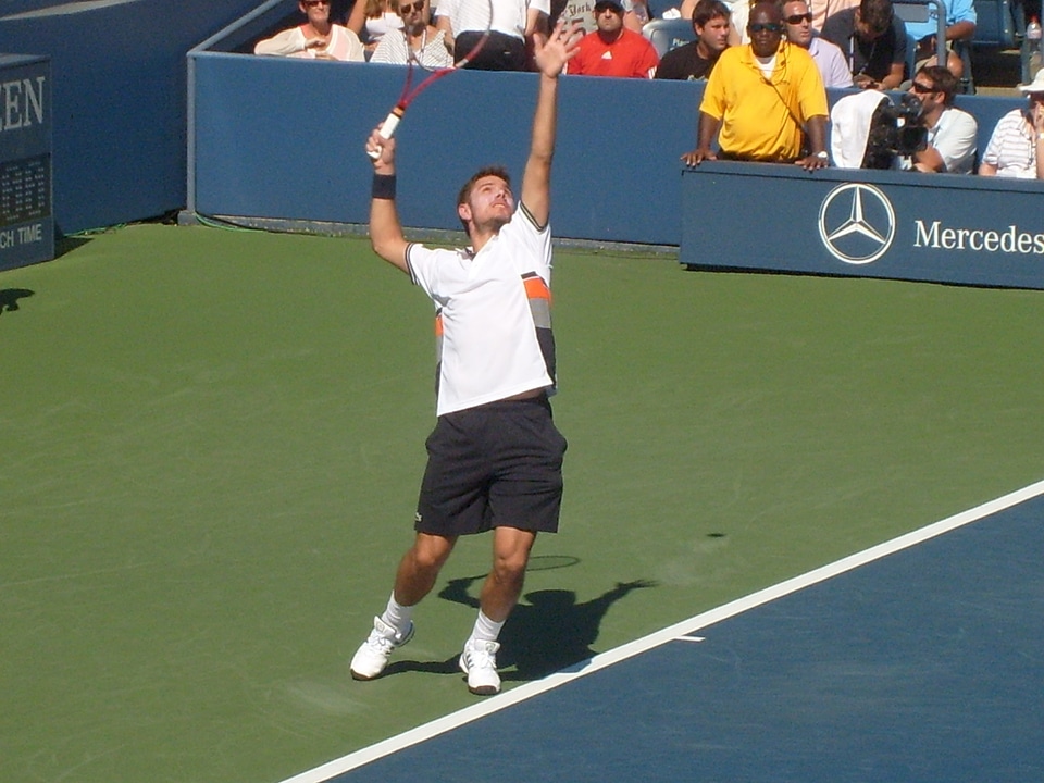 Athlete serving court