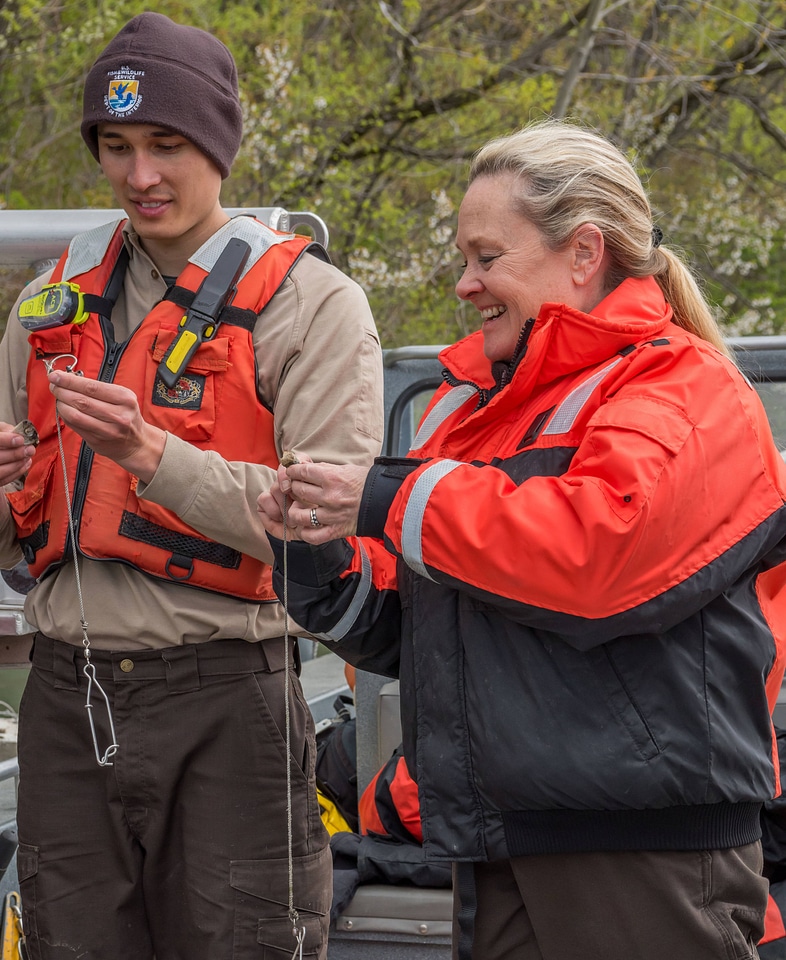 USFWS Fisheries workers bait hooks for Lake sturgeon capture