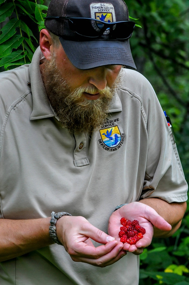 NCTC land management specialist with wine raspberries