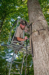 NCTC land management specialist inspecting deer stand for safety-1