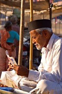 Man reading newspaper photo