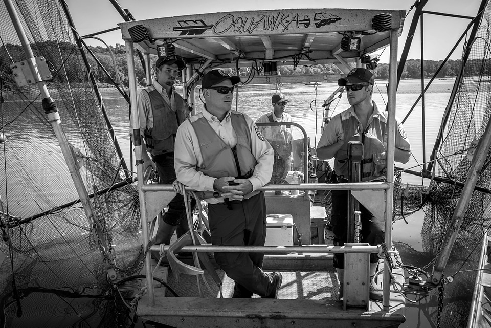 Fisheries crew of the U.S. Fish and Wildlife Service boat, The Magna Carpa, on Missouri River