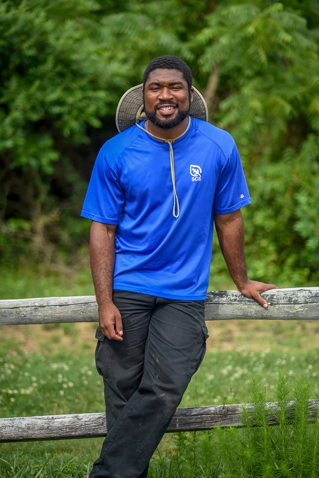 SCA Intern poses by rail