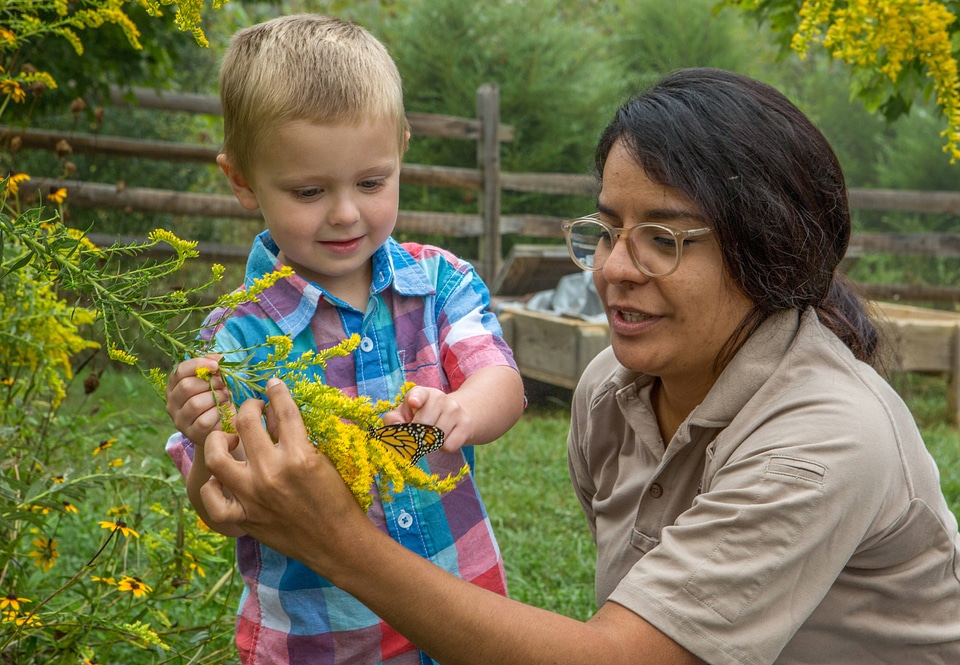Child and FWS biologist with monarch butterfly-1