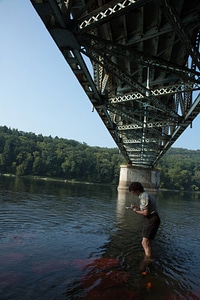 Refuge biologist counts freshwater mussels in river