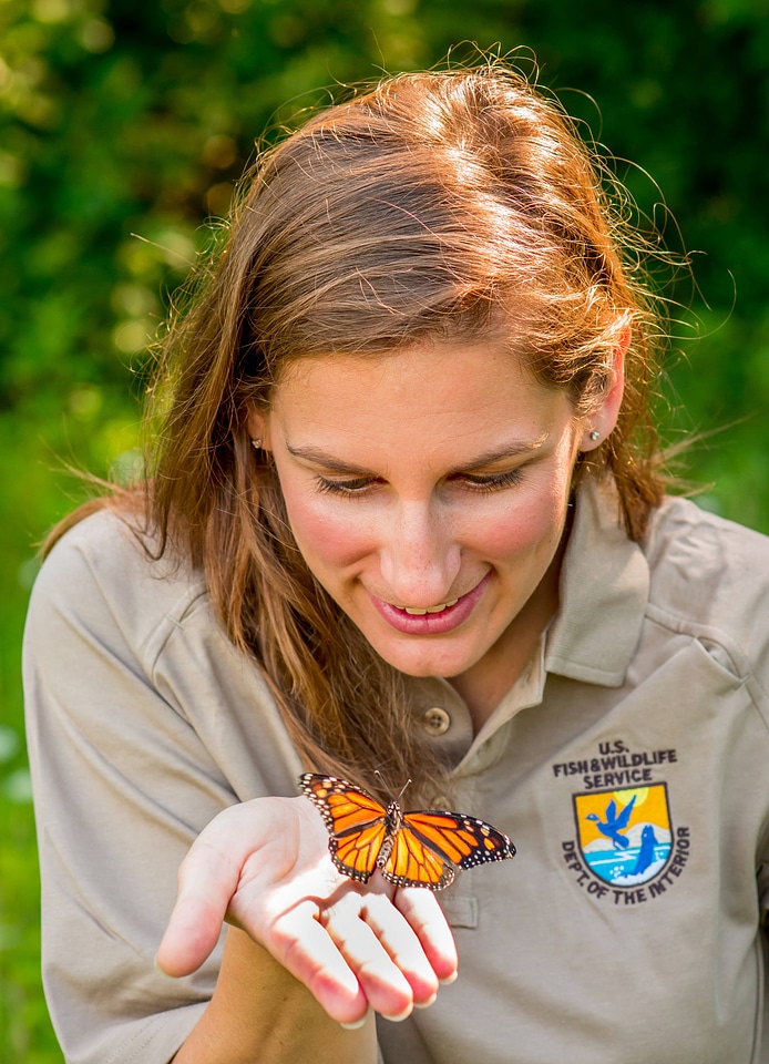 Service employee with Monarch butterfly