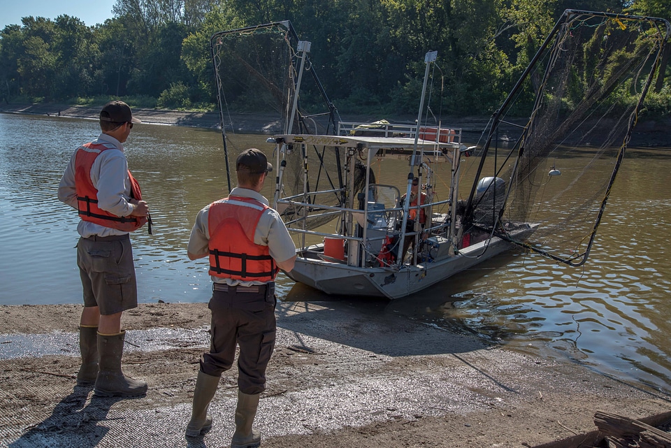 Crew of the U.S. Fish and Wildlife Service boat, The Magna Carpa, launching boat