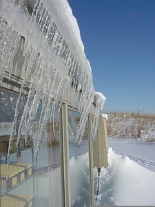 Icicle hanging from roof photo