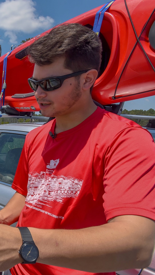 Kayaker at car