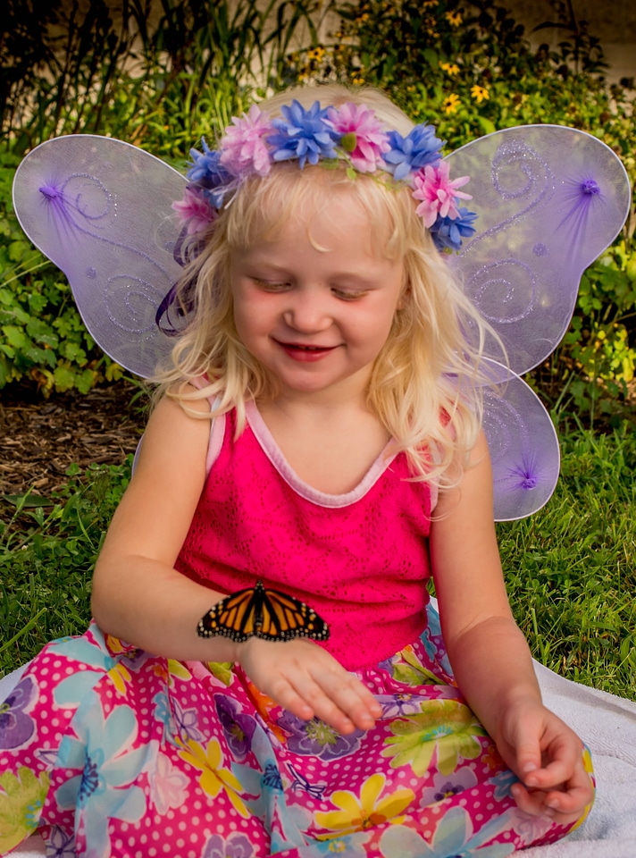 Monarch on little girl