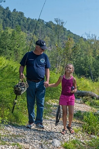 Older man with young girl fishing-1