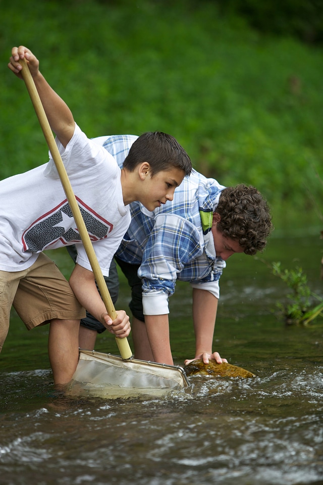 Boys search for macroinvertebrates