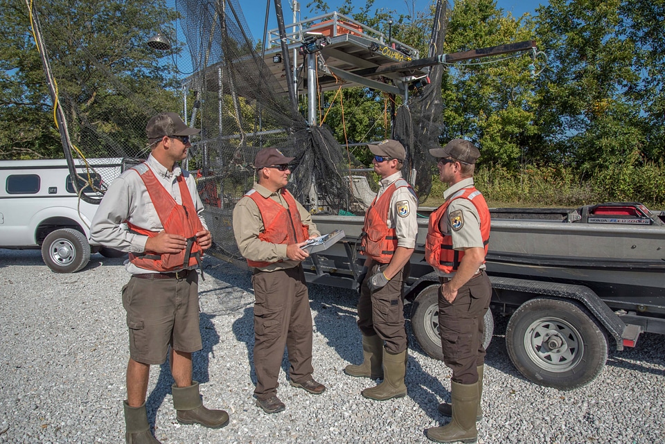 Crew of the U.S. Fish and Wildlife Service boat, The Magna Carpa, safety briefing