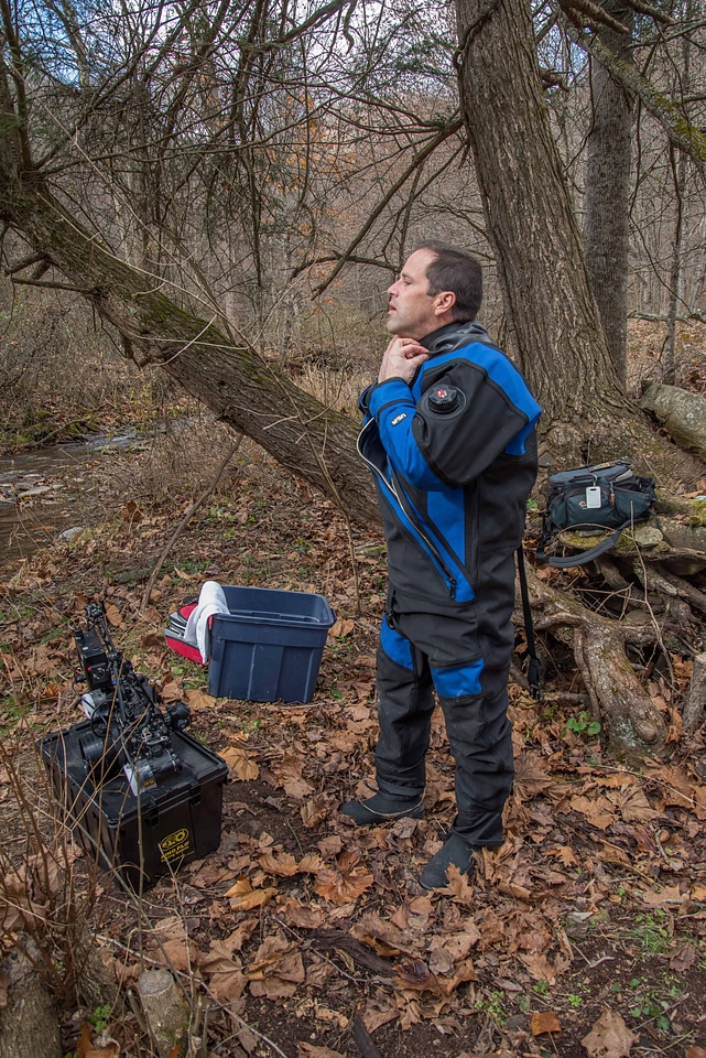 Photographer suits up for a dive