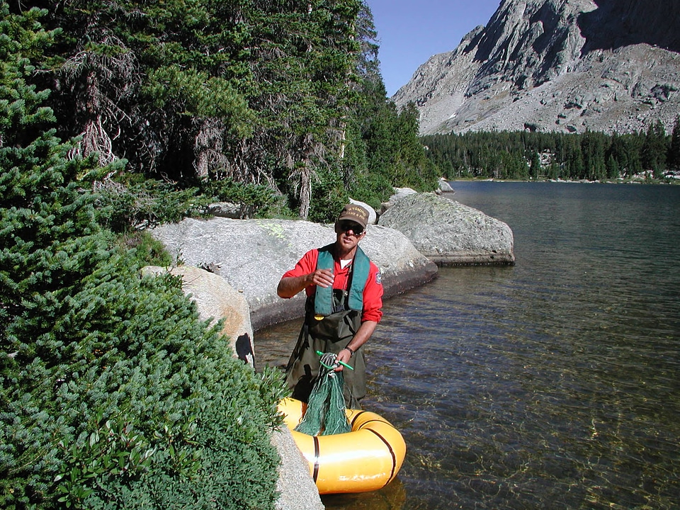 Biologist in raft during a fish population survey