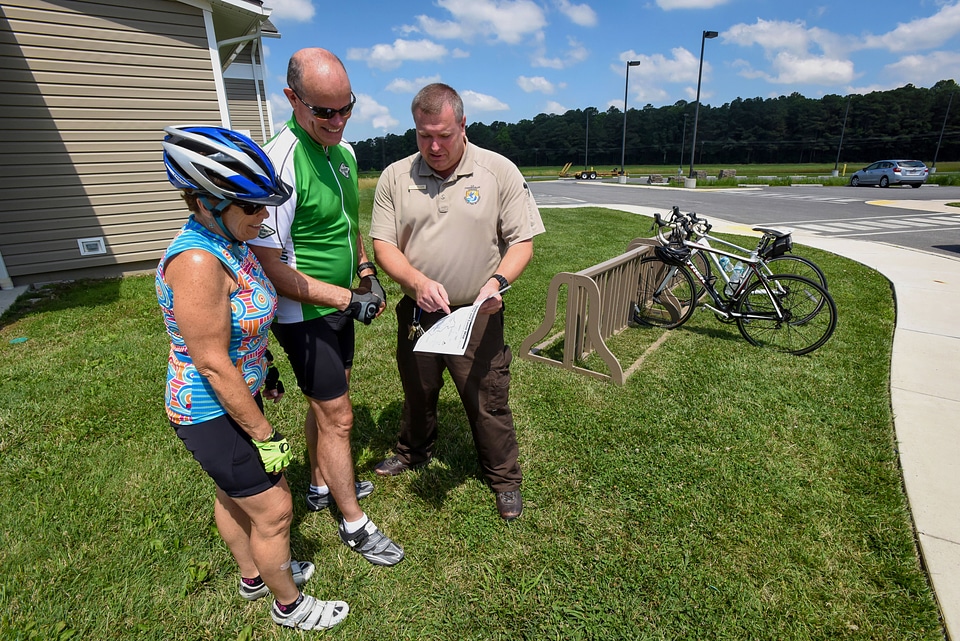 FWS Staffer shows bicyclists a map