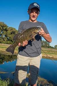 Boy with smallmouth bass photo