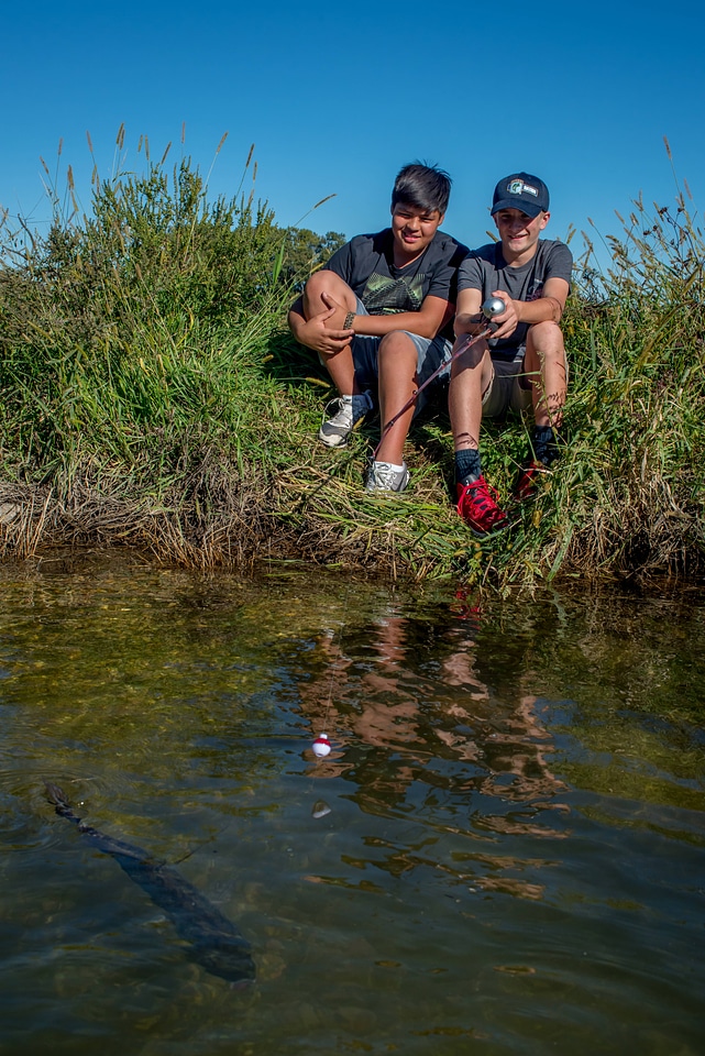 Two boys fishing for small mouth bass-1