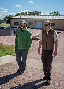 Biologists walking at Gavins Point National Fish Hatchery