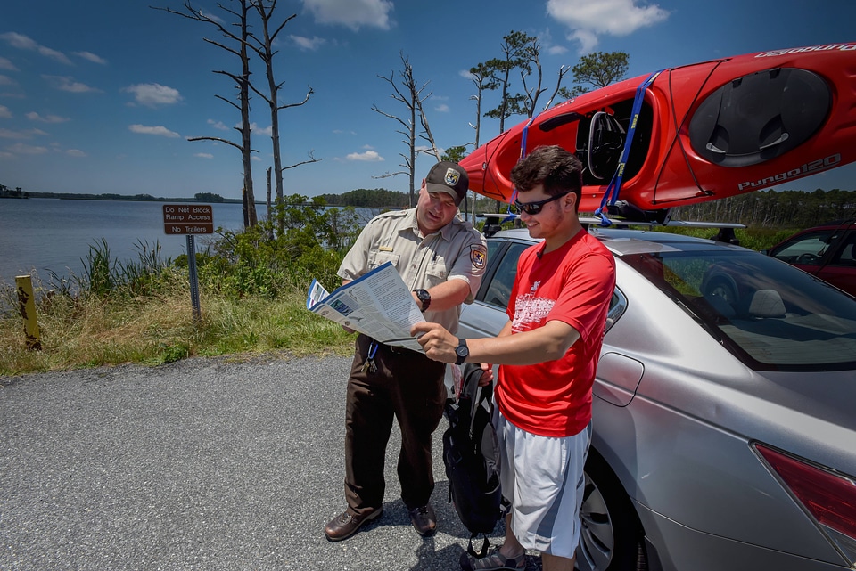 FWS Staffer shows kayaker a map