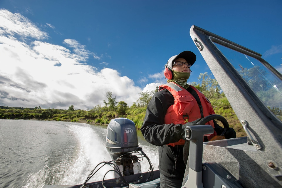 Biologist pilots boat on the Andreafsky River