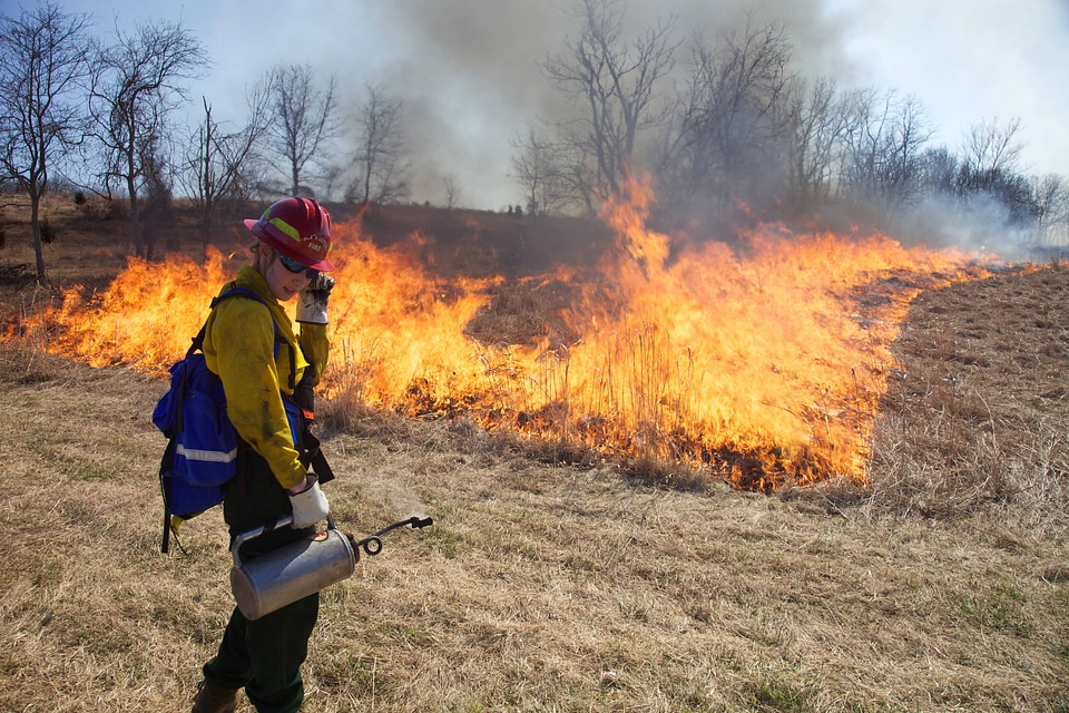 Firefighter with equipment in hand